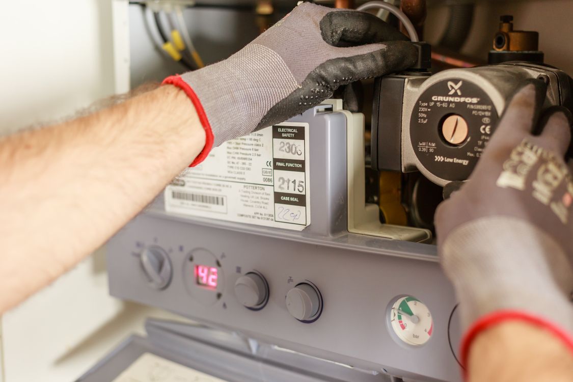 "Heating engineer servicing a domestic gas boiler"